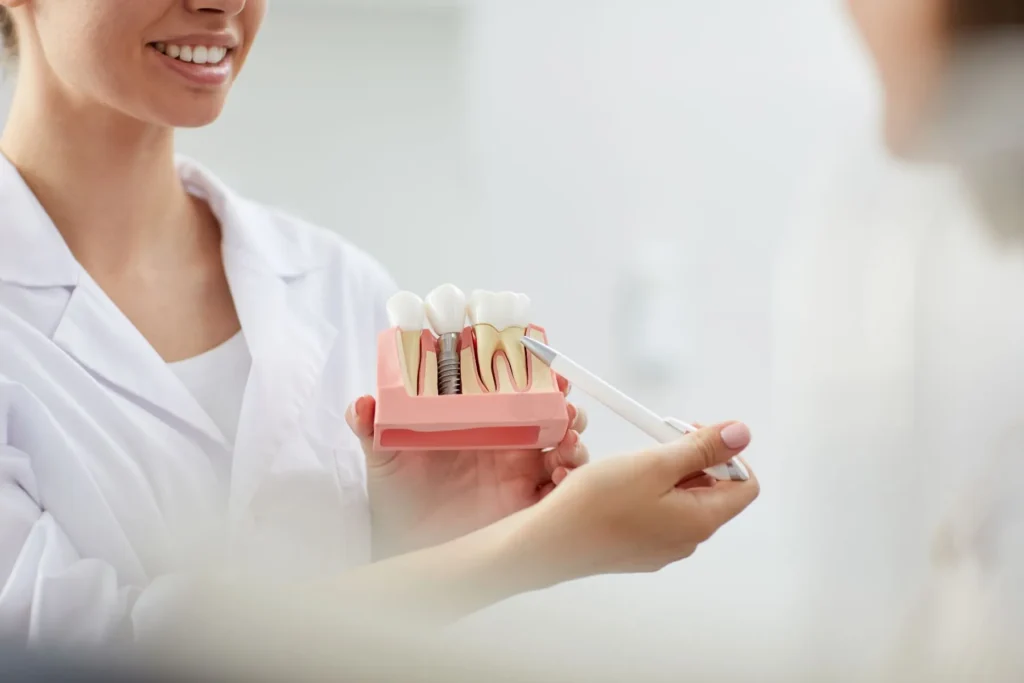 difference between dentures and dental implants